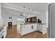 Modern kitchen features granite countertops, stainless steel appliances and hardwood flooring at 503 Bendemeer Ln, Rolesville, NC 27571