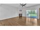 Bright living room with hardwood floors, fireplace, and sliding glass doors to the outside at 503 Bendemeer Ln, Rolesville, NC 27571