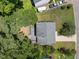 An aerial view of the property with a back deck and green surroundings at 505 Drolmond Dr, Raleigh, NC 27615