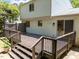 Exterior view of a wooden deck and the back of a two-story home at 505 Drolmond Dr, Raleigh, NC 27615