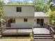 Back of house featuring deck, backyard and sliding doors for indoor/outdoor living at 505 Drolmond Dr, Raleigh, NC 27615