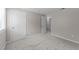 A bright, carpeted bedroom featuring painted walls and a view into the hall at 505 Drolmond Dr, Raleigh, NC 27615