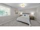 Cozy bedroom features neutral walls, carpet, natural light, and stylish decorative lighting at 505 Drolmond Dr, Raleigh, NC 27615