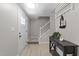Inviting entryway featuring a staircase, table, and modern design at 505 Drolmond Dr, Raleigh, NC 27615