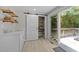 Pantry with sliding decorative door and access to outdoor deck at 505 Drolmond Dr, Raleigh, NC 27615