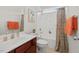 Well-lit bathroom with a shower-tub combination, featuring a modern vanity and stylish decorative accents at 507 Turmeric Ln, Durham, NC 27713