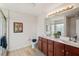 Bright bathroom features dual sinks, vanity with storage, and a beautifully tiled shower at 507 Turmeric Ln, Durham, NC 27713