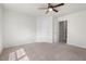 Comfortable bedroom with ceiling fan, neutral carpet, and a convenient doorway, ready for personalization at 507 Turmeric Ln, Durham, NC 27713