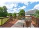 Outdoor deck featuring a seating area with a table and chairs, perfect for relaxing and enjoying the view at 507 Turmeric Ln, Durham, NC 27713