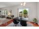 Cozy dining area with hardwood floors, sliding glass doors to a deck, and a view of the outdoors at 507 Turmeric Ln, Durham, NC 27713