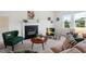 Comfortable living room featuring a fireplace, stylish decor, and plenty of natural light at 507 Turmeric Ln, Durham, NC 27713