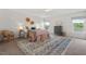 Airy main bedroom features large windows, plush carpet, and stylish furnishings at 507 Turmeric Ln, Durham, NC 27713