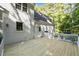 The back of this home features a spacious deck and lots of outdoor space at 5216 Woods End Rd, Hillsborough, NC 27278