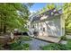 This home features a large yard and a spacious deck off the back at 5216 Woods End Rd, Hillsborough, NC 27278