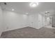 Finished basement with neutral walls and carpet, providing a versatile living space at 5216 Woods End Rd, Hillsborough, NC 27278