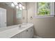 Bathroom with long vanity, bright window, and lots of light at 5216 Woods End Rd, Hillsborough, NC 27278