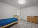 Cozy bedroom featuring a single bed and wooden dresser, perfect for guests at 5216 Woods End Rd, Hillsborough, NC 27278