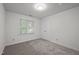 Bright bedroom with a double-door closet, fresh paint and plush carpeting at 5216 Woods End Rd, Hillsborough, NC 27278