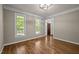 Entry room highlighting hardwood floors, natural light, and neutral paint color at 5216 Woods End Rd, Hillsborough, NC 27278