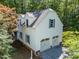 Shot of the garage features two bays, a spacious yard, and a private driveway at 5216 Woods End Rd, Hillsborough, NC 27278