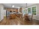 Eat-in kitchen featuring stainless steel appliances, granite countertops, and natural wood cabinets at 5216 Woods End Rd, Hillsborough, NC 27278