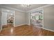 Spacious room showcasing hardwood floors and view to dining and living rooms at 5216 Woods End Rd, Hillsborough, NC 27278