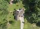 Aerial view of a home surrounded by trees, featuring a well-manicured lawn at 55 Kristopher Woods Dr, Youngsville, NC 27596