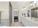 An ensuite bathroom features a double vanity, tiled floors, and glass shower at 55 Kristopher Woods Dr, Youngsville, NC 27596