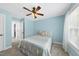 Cozy bedroom features a ceiling fan, carpet, and a view to the hallway at 55 Kristopher Woods Dr, Youngsville, NC 27596