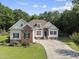Charming two-story home with landscaped yard and a long driveway at 55 Kristopher Woods Dr, Youngsville, NC 27596