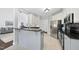 Well lit kitchen with modern appliances and granite countertops at 55 Kristopher Woods Dr, Youngsville, NC 27596