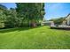 Lush backyard featuring well-maintained lawn space, perfect for relaxation and entertainment at 6022 Little Creek Church Rd, Clayton, NC 27520