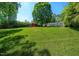 Expansive backyard with a vibrant green lawn, providing ample space for outdoor activities at 6022 Little Creek Church Rd, Clayton, NC 27520