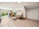A finished basement featuring a sofa, shelving, and wood-look floors at 6022 Little Creek Church Rd, Clayton, NC 27520