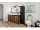 Updated bathroom with wood vanity, black hardware, and modern fixtures at 6022 Little Creek Church Rd, Clayton, NC 27520