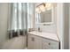 Bright bathroom with updated vanity, faucet, and fixtures at 6022 Little Creek Church Rd, Clayton, NC 27520