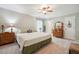 Neutral bedroom with ceiling fan, carpet, and a calm color palette at 6022 Little Creek Church Rd, Clayton, NC 27520