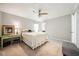 Neutral bedroom with a ceiling fan and a calm color palette at 6022 Little Creek Church Rd, Clayton, NC 27520