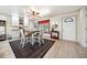 Charming dining area featuring a dining table and chairs with a stylish rug, and a doorway at 6022 Little Creek Church Rd, Clayton, NC 27520