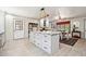 Spacious kitchen featuring a large center island with marble countertops and white cabinets at 6022 Little Creek Church Rd, Clayton, NC 27520