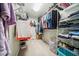Bright walk-in closet with wire shelving to maximize storage and organization at 6022 Little Creek Church Rd, Clayton, NC 27520