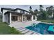 Backyard featuring a pool, covered patio, and exterior fireplace perfect for outdoor living at 6736 Brixley Crest Ct, Raleigh, NC 27614