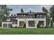 Stunning two-story modern home with stone accents, dark trim, and an inviting front yard at 6736 Brixley Crest Ct, Raleigh, NC 27614