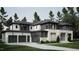 Stunning exterior view of home, featuring a three-car garage, contrasting trim and landscaped yard at 6736 Brixley Crest Ct, Raleigh, NC 27614