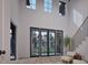 Bright, soaring foyer with a modern staircase, large windows, and stylish decor at 6736 Brixley Crest Ct, Raleigh, NC 27614