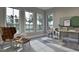 Bright office space featuring modern furnishings, a desk, and expansive windows with a view at 6736 Brixley Crest Ct, Raleigh, NC 27614