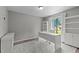 Bright home office with white desk, shelving, and lots of natural light at 7309 Forest Glade Ct, Raleigh, NC 27615