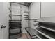 Organized walk-in closet with metal shelving and rods for optimal storage at 7309 Forest Glade Ct, Raleigh, NC 27615