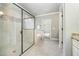 Spa-like bathroom features a glass shower, soaking tub, and tiled floor at 7809 Chestnut Branch Ct, Raleigh, NC 27612
