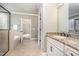 Bright bathroom features a tiled floor, granite vanity, and glass enclosed shower at 7809 Chestnut Branch Ct, Raleigh, NC 27612